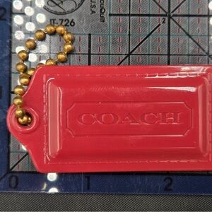 Coach Cherry Red Bag Tag with Gold Chain